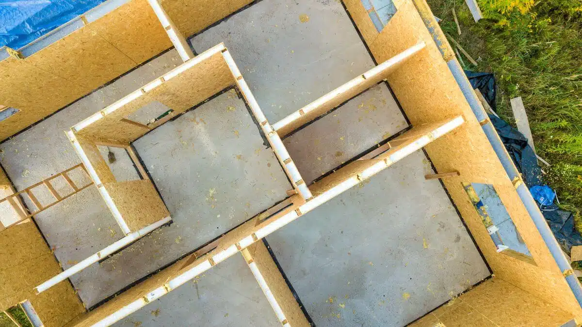 Workers assemble prefabricated construction modules at the site, streamlining the building process with efficiency and precision.