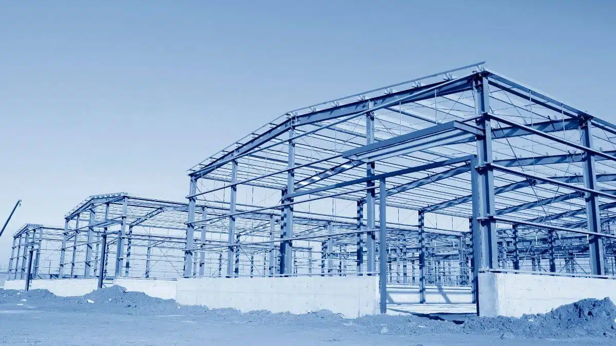 Workers assemble prefabricated construction modules at the site, streamlining the building process with efficiency and precision.